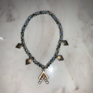 Blue bracelet with gold accents